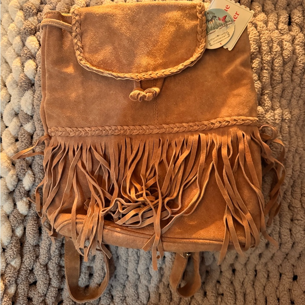 Tan Leather Backpack with Fringe and Flap Closure